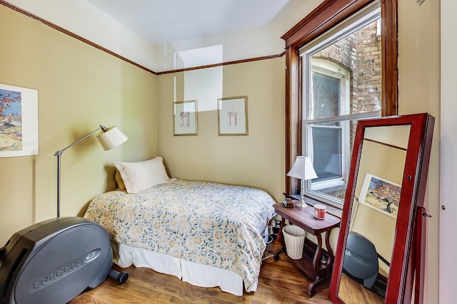 bedroom with hardwood / wood-style floors