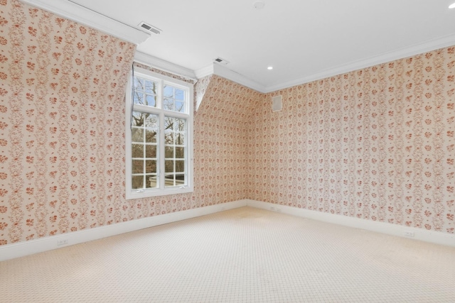 carpeted spare room with ornamental molding