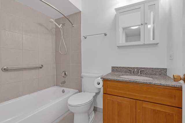 full bathroom featuring vanity, tiled shower / bath combo, tile patterned floors, and toilet