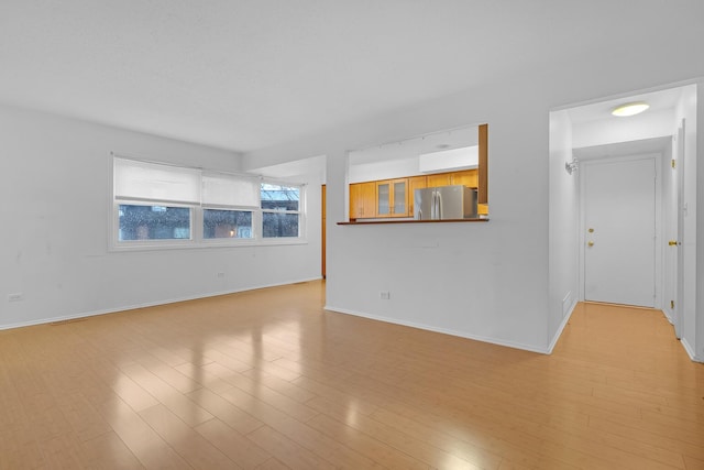 empty room with light hardwood / wood-style floors