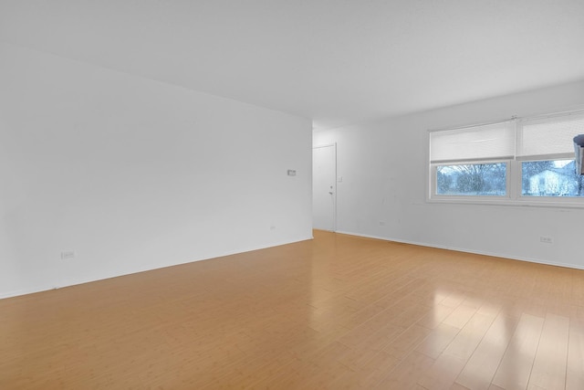 unfurnished room featuring light hardwood / wood-style flooring