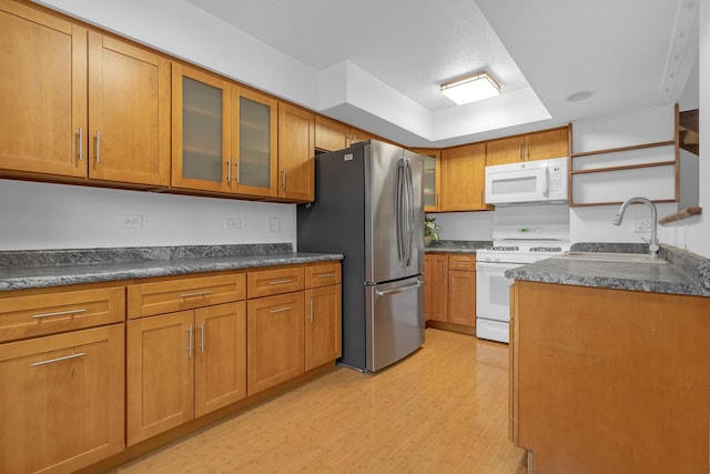 kitchen with sink and white appliances