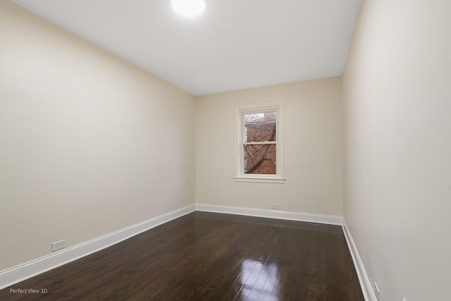 unfurnished room with dark hardwood / wood-style floors