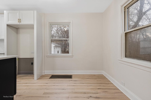 unfurnished room featuring light wood-type flooring