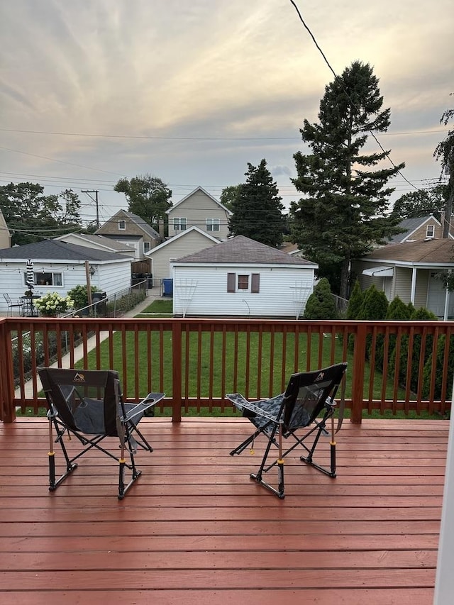 deck at dusk with a lawn