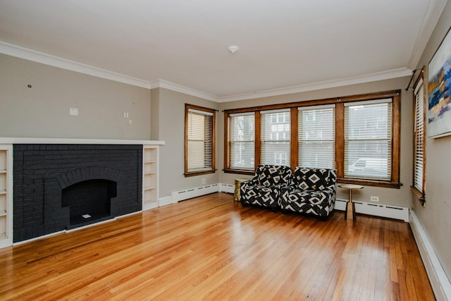 living room with baseboard heating, ornamental molding, wood-type flooring, and a brick fireplace