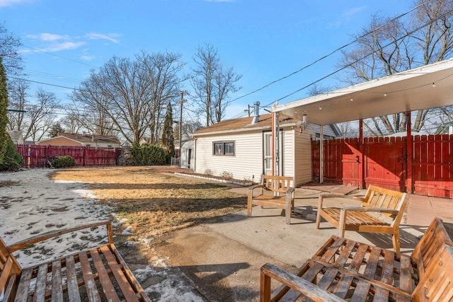 view of patio featuring an outbuilding