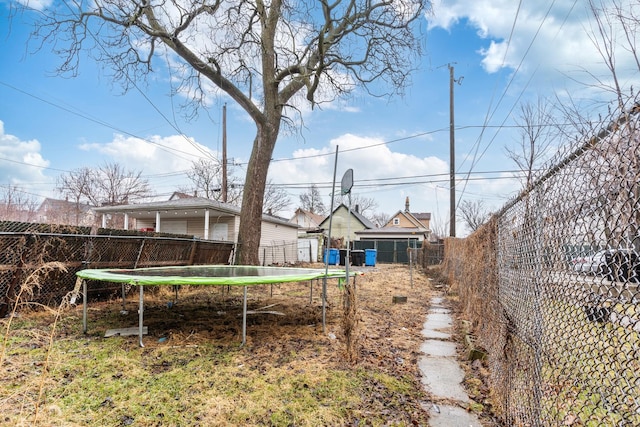 view of yard featuring a trampoline