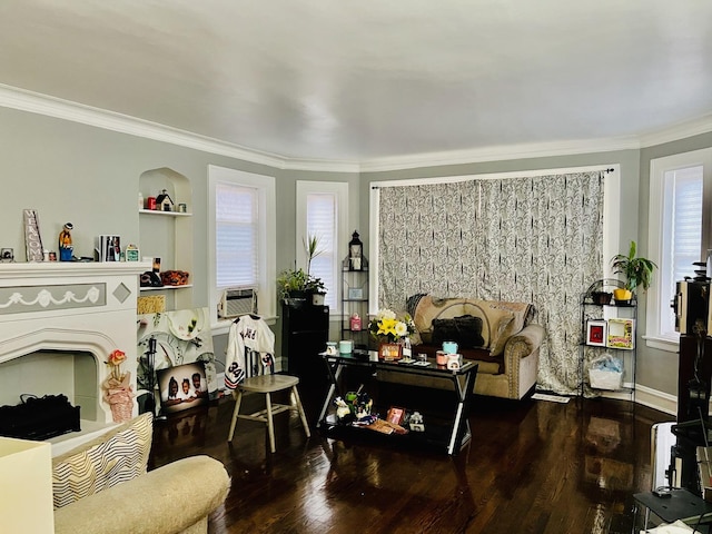 living room featuring crown molding, plenty of natural light, and wood-type flooring