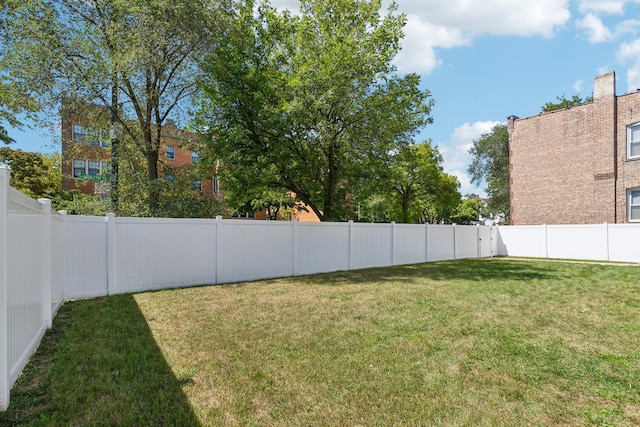 view of yard with a fenced backyard