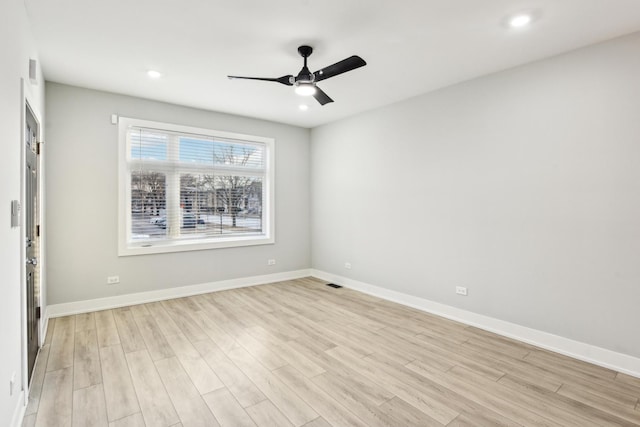 spare room with baseboards, ceiling fan, recessed lighting, and light wood-style floors