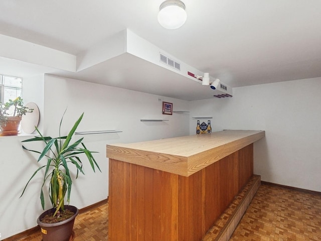 bar featuring parquet floors