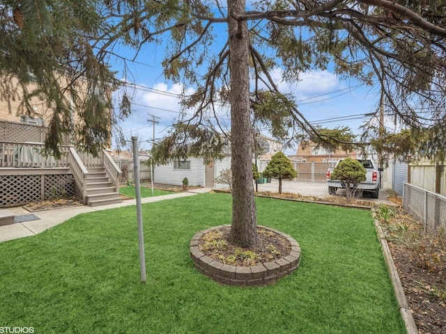 view of yard featuring a wooden deck