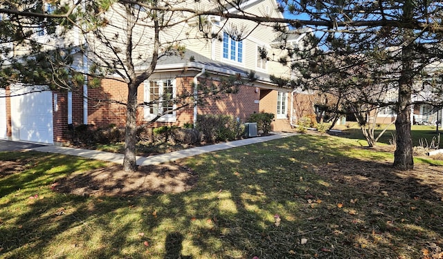 view of side of home featuring a lawn