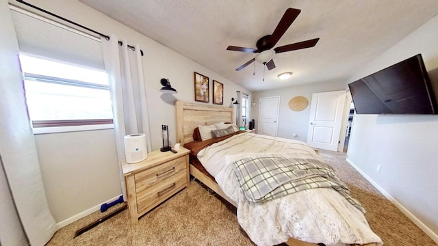 bedroom with light carpet and ceiling fan