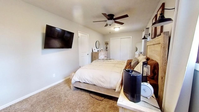 bedroom with ceiling fan, a closet, and carpet