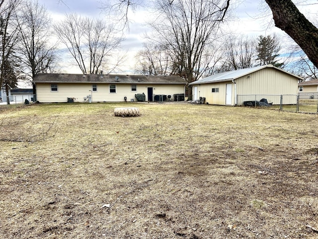 back of house with a yard