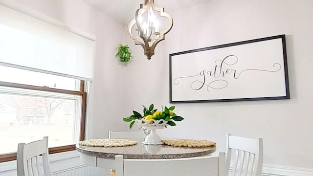 dining space featuring a notable chandelier