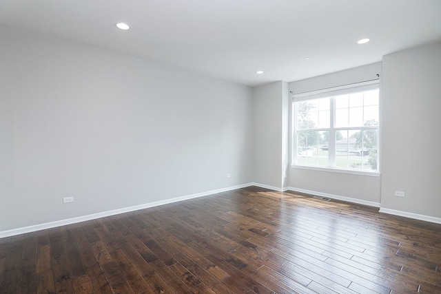 empty room featuring dark hardwood / wood-style floors