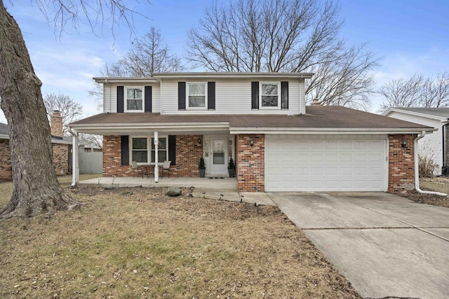 front facade with a garage and covered porch