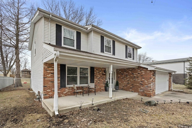 front of property featuring a garage and covered porch