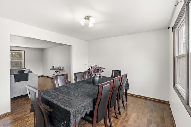 dining space featuring dark hardwood / wood-style flooring