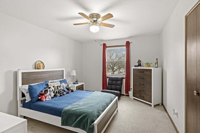 carpeted bedroom with ceiling fan