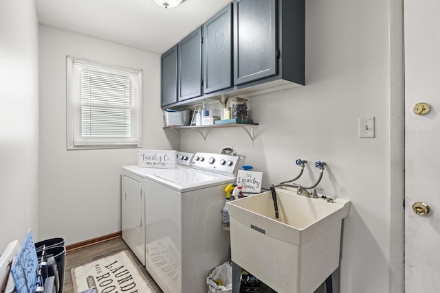 washroom with cabinets, hardwood / wood-style flooring, sink, and independent washer and dryer