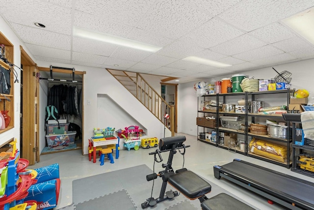 exercise area with a paneled ceiling