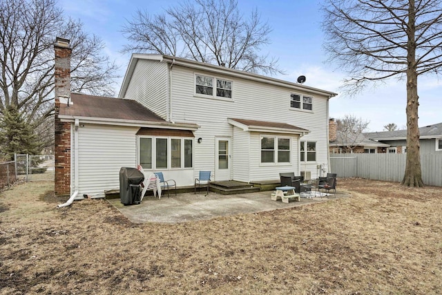 back of property with a patio