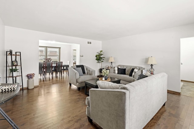 living room featuring dark hardwood / wood-style floors