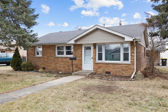 bungalow-style house with a front yard