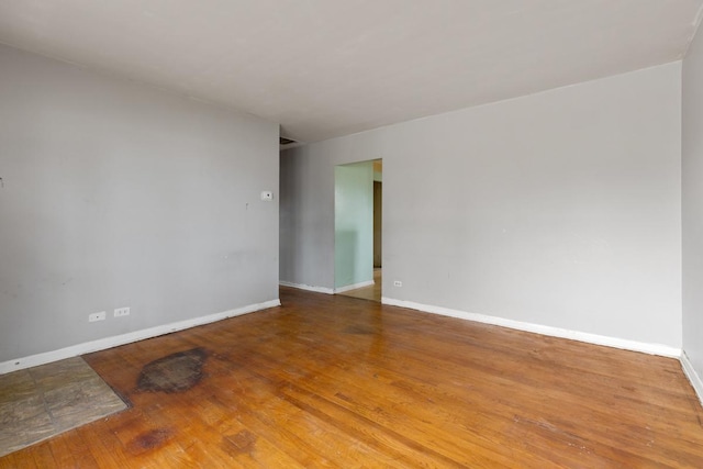 spare room with hardwood / wood-style flooring