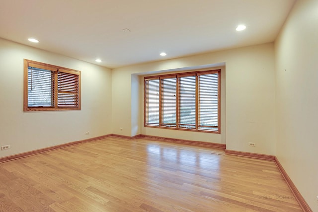 empty room with light hardwood / wood-style floors