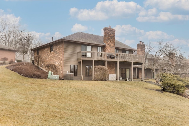 back of house with a wooden deck and a yard