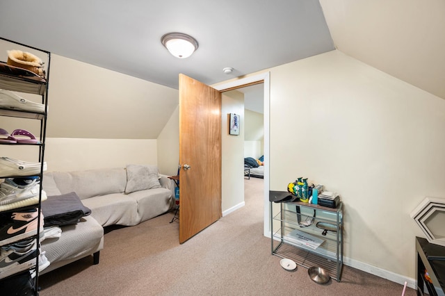 living area featuring vaulted ceiling and light carpet