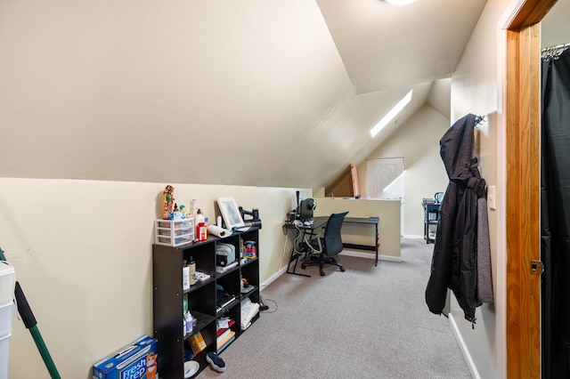 carpeted office with lofted ceiling