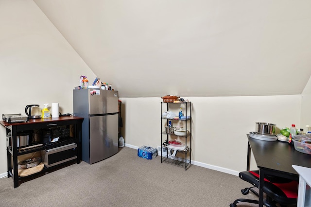 interior space featuring vaulted ceiling and carpet