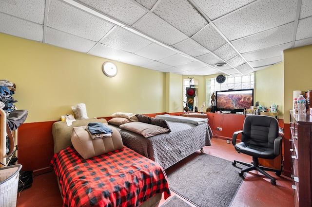 bedroom with a paneled ceiling