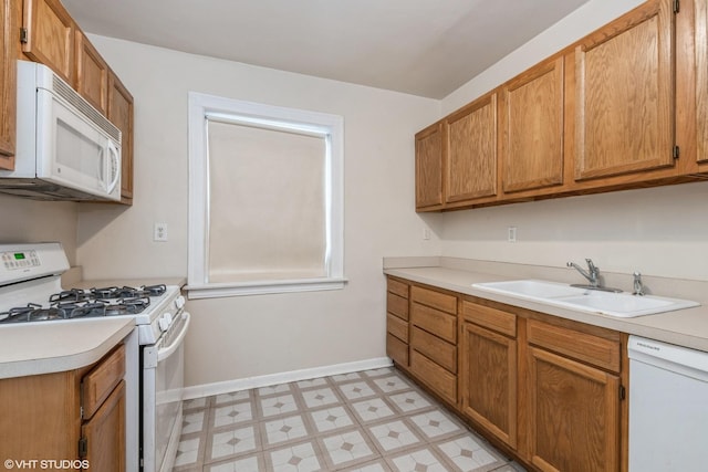 kitchen with sink and white appliances