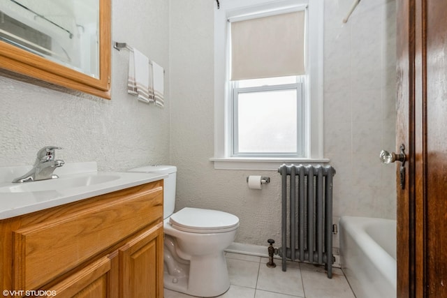 full bathroom with radiator, tile patterned flooring, tiled shower / bath combo, vanity, and toilet