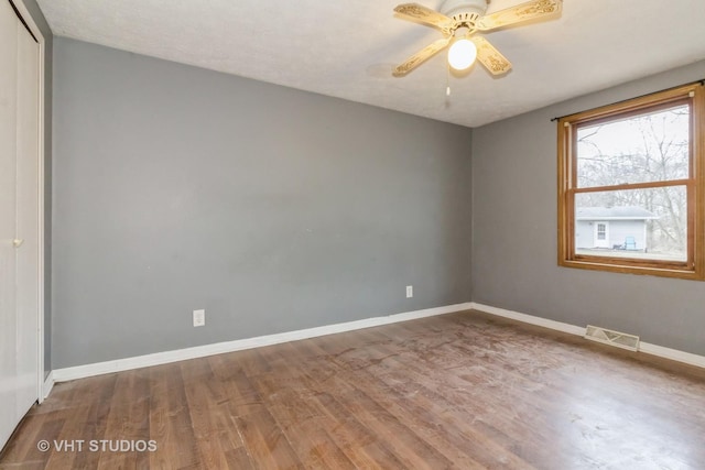 unfurnished room featuring ceiling fan and wood-type flooring