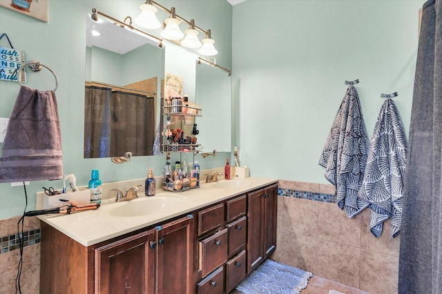 bathroom with walk in shower and vanity