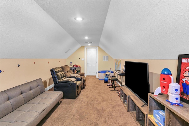 living room featuring lofted ceiling, light carpet, and a textured ceiling