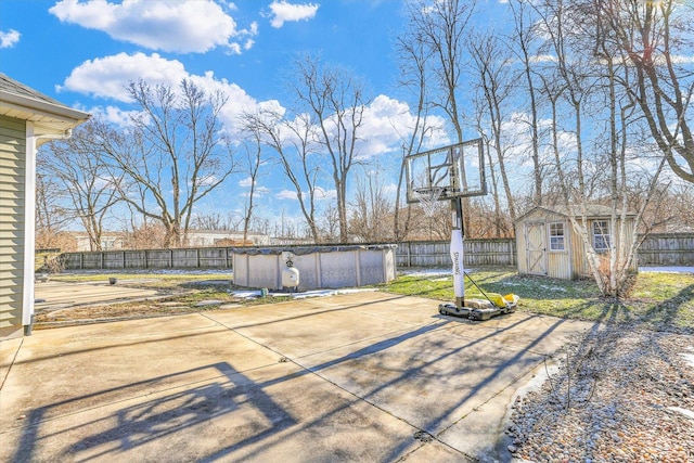 view of patio featuring a storage shed and a covered pool