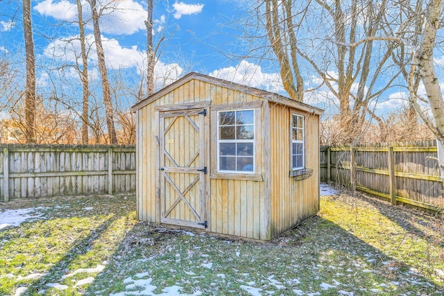 view of outbuilding with a yard