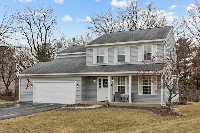 front facade featuring a garage, covered porch, and a front yard