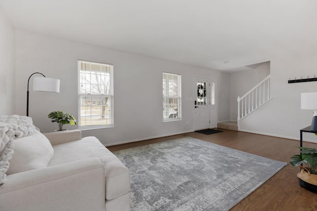 living room with plenty of natural light and hardwood / wood-style floors