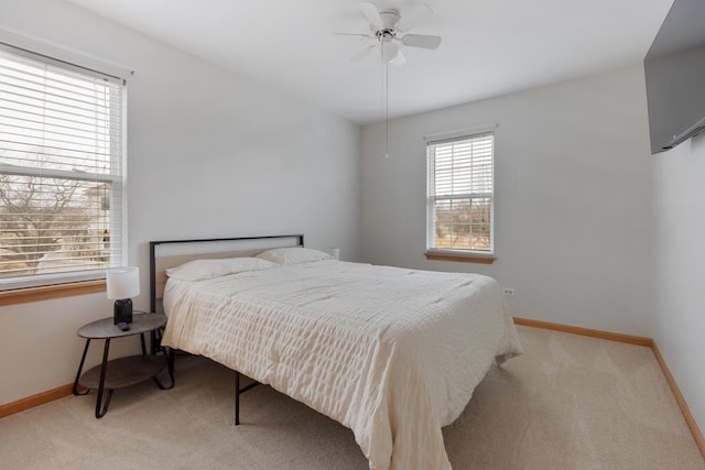 bedroom with light colored carpet and ceiling fan