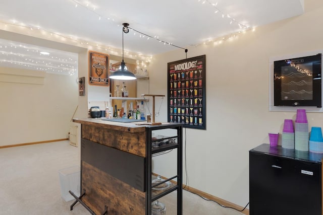 bar with pendant lighting and light colored carpet